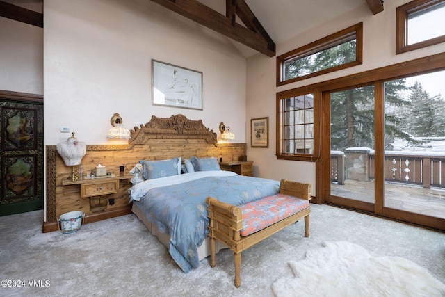 carpeted bedroom with beam ceiling, high vaulted ceiling, and access to outside