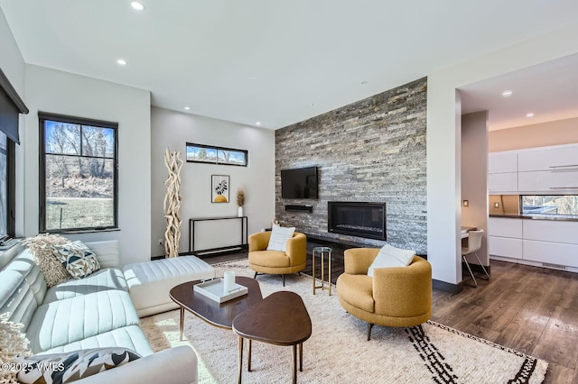 116 Thresher Ct, Eagle, CO 81631 - living room featuring recessed lighting, a stone fireplace, and wood finished floors
