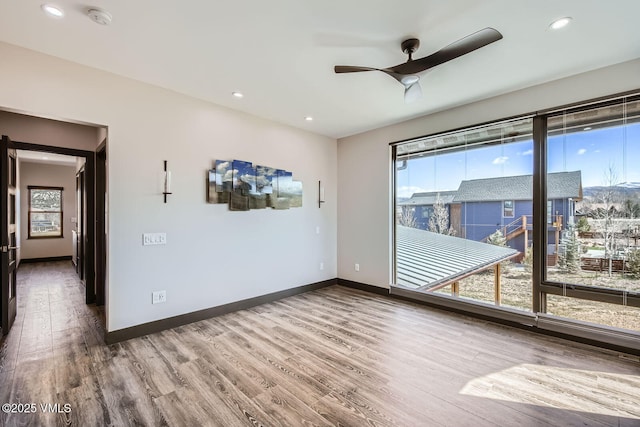 116 Thresher Ct, Eagle, CO 81631 - empty room with a healthy amount of sunlight, ceiling fan, and wood finished floors