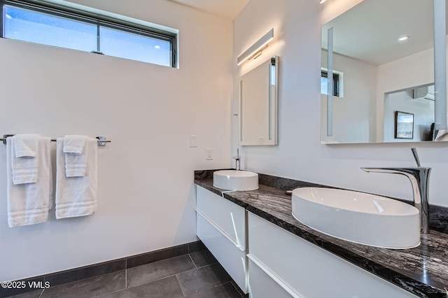 116 Thresher Ct, Eagle, CO 81631 - full bathroom with tile patterned flooring, double vanity, baseboards, and a sink