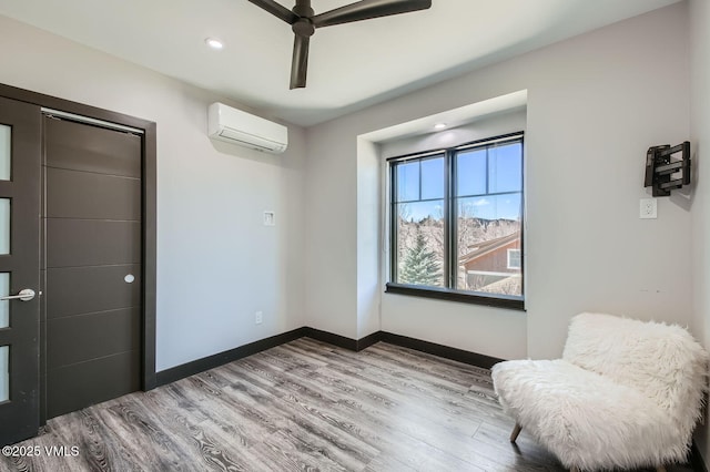 116 Thresher Ct, Eagle, CO 81631 - living area featuring a wall mounted AC, baseboards, recessed lighting, ceiling fan, and wood finished floors