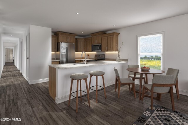 kitchen with sink, appliances with stainless steel finishes, a kitchen breakfast bar, dark hardwood / wood-style floors, and kitchen peninsula