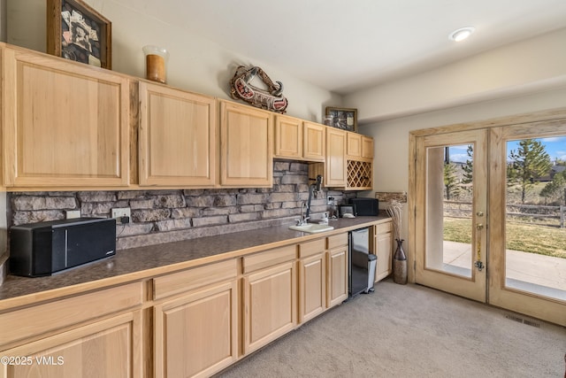111 E Double Hitch Dr, Eagle, CO 81631 - kitchen featuring light carpet, french doors, backsplash, dark countertops, and light brown cabinetry
