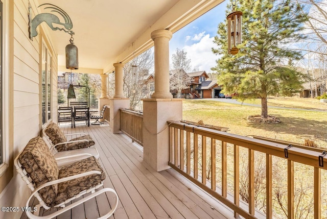 111 E Double Hitch Dr, Eagle, CO 81631 - wooden deck featuring a porch and a lawn
