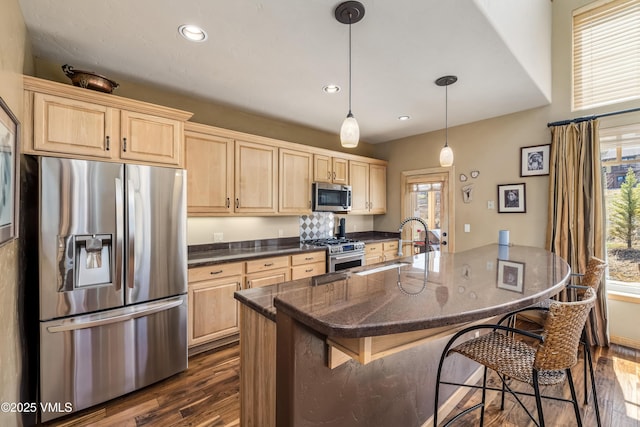 111 E Double Hitch Dr, Eagle, CO 81631 - kitchen with dark wood-style flooring, light brown cabinets, and stainless steel appliances