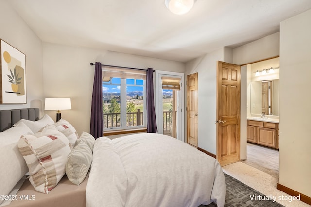 111 E Double Hitch Dr, Eagle, CO 81631 - bedroom featuring a sink, baseboards, access to outside, and connected bathroom
