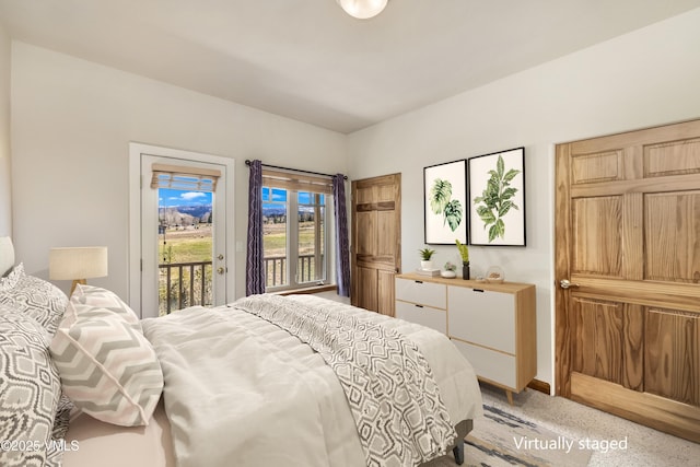 111 E Double Hitch Dr, Eagle, CO 81631 - bedroom with access to exterior, light colored carpet, and baseboards