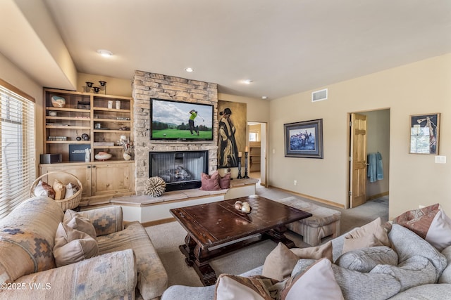 111 E Double Hitch Dr, Eagle, CO 81631 - carpeted living room featuring a stone fireplace, visible vents, baseboards, and recessed lighting