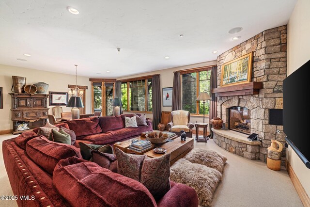825 Forest Rd Unit 2, Vail, CO 81657 - living room featuring carpet flooring, a stone fireplace, and recessed lighting