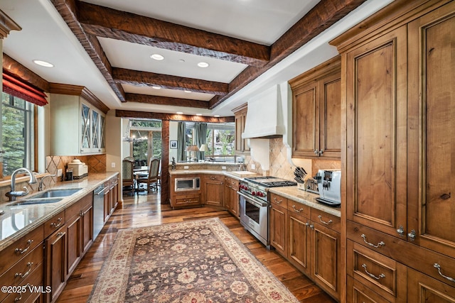 825 Forest Rd Unit 2, Vail, CO 81657 - kitchen featuring appliances with stainless steel finishes, custom exhaust hood, wood-type flooring, backsplash, and recessed lighting
