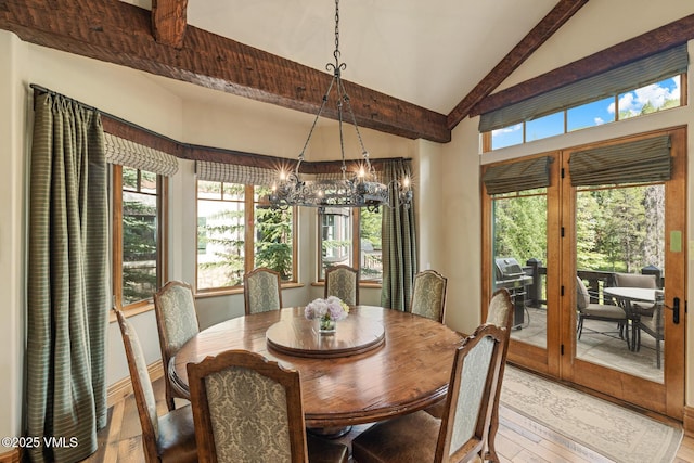 825 Forest Rd Unit 2, Vail, CO 81657 - dining room featuring a chandelier, light wood finished floors, beamed ceiling, and high vaulted ceiling