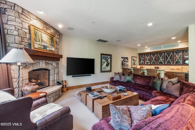 825 Forest Rd Unit 2, Vail, CO 81657 - carpeted living room featuring wine cooler, a stone fireplace, and recessed lighting