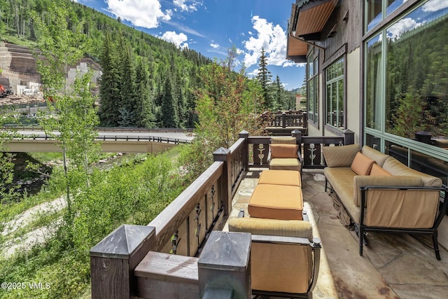 825 Forest Rd Unit 2, Vail, CO 81657 - balcony with an outdoor hangout area and a view of trees