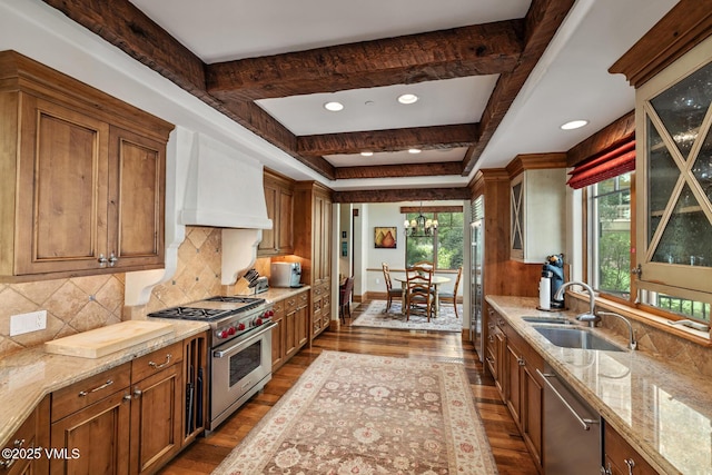 825 Forest Rd Unit 2, Vail, CO 81657 - kitchen with stainless steel appliances, premium range hood, brown cabinetry, dark wood-style flooring, and recessed lighting