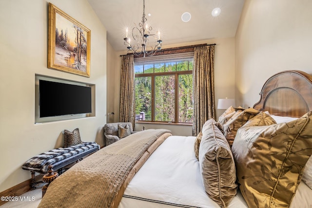 825 Forest Rd Unit 2, Vail, CO 81657 - bedroom featuring a chandelier and vaulted ceiling