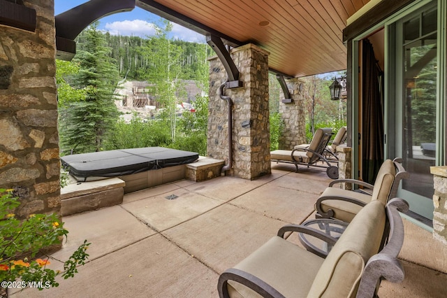 825 Forest Rd Unit 2, Vail, CO 81657 - view of patio featuring a covered hot tub