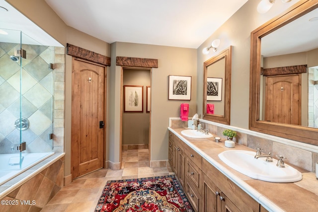 825 Forest Rd Unit 2, Vail, CO 81657 - bathroom with double vanity and tiled shower / bath