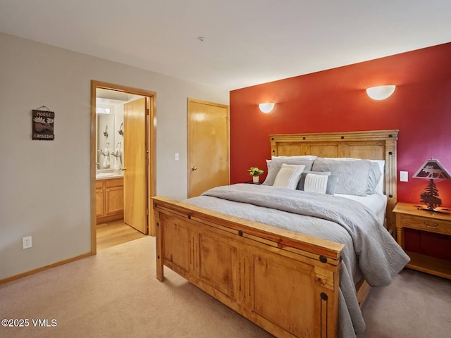 10000 Ryan Gulch Rd Unit 114, Silverthorne, CO 80498 - bedroom featuring light carpet and ensuite bath