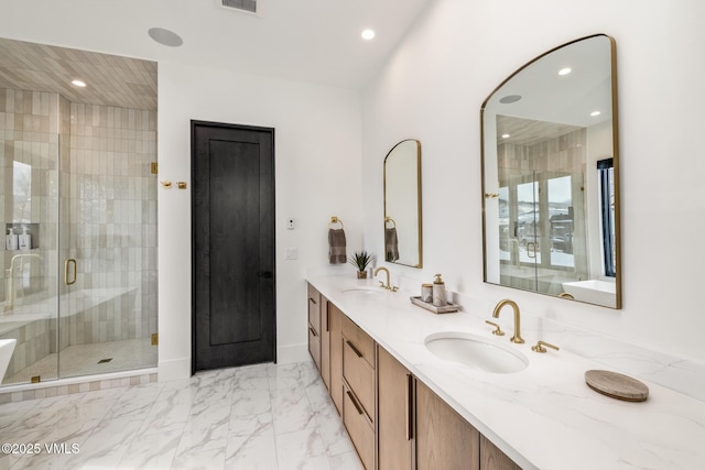 full bath featuring double vanity, recessed lighting, a stall shower, marble finish floor, and a sink