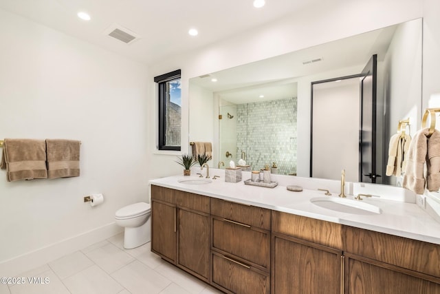 full bath with visible vents, a stall shower, toilet, and a sink