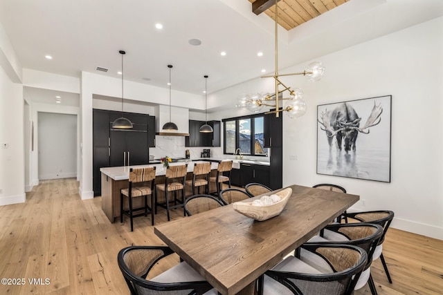 dining space featuring light wood-style flooring, recessed lighting, baseboards, and visible vents