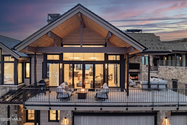 rear view of house featuring a balcony