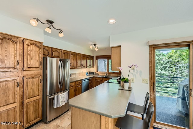 3050 Wildridge Rd Unit 3, Avon, CO 81620 - kitchen featuring freestanding refrigerator, dishwashing machine, a peninsula, healthy amount of natural light, and recessed lighting