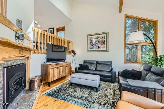 3050 Wildridge Rd Unit 3, Avon, CO 81620 - living room featuring wood finished floors, a fireplace with flush hearth, and beamed ceiling