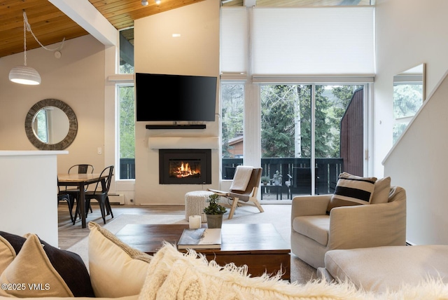 1989 Circle Dr, Vail, CO 81657 - living room with high vaulted ceiling, wooden ceiling, a fireplace, wood finished floors, and beam ceiling