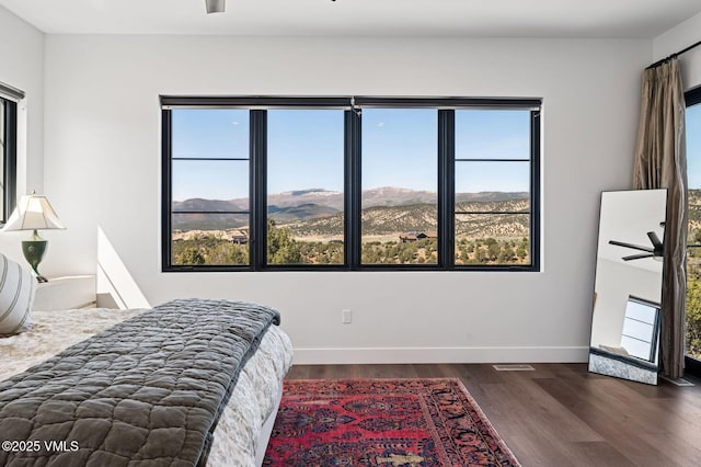 2296 E Haystacker Dr, Eagle, CO 81631 - bedroom with dark wood-type flooring and baseboards