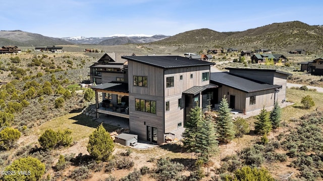 2296 E Haystacker Dr, Eagle, CO 81631 - back of property with metal roof, a standing seam roof, and a mountain view