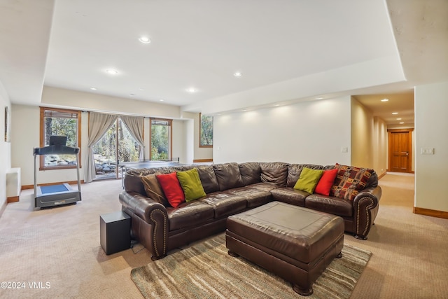 living room with light carpet, recessed lighting, and baseboards