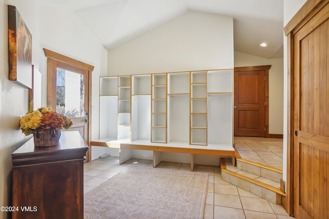 mudroom featuring vaulted ceiling and light tile patterned floors