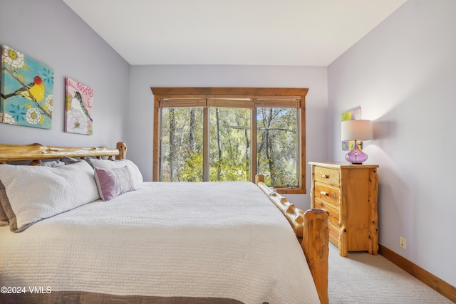 bedroom with carpet and baseboards