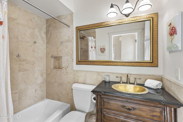 full bathroom featuring vanity, shower / tub combo, and toilet