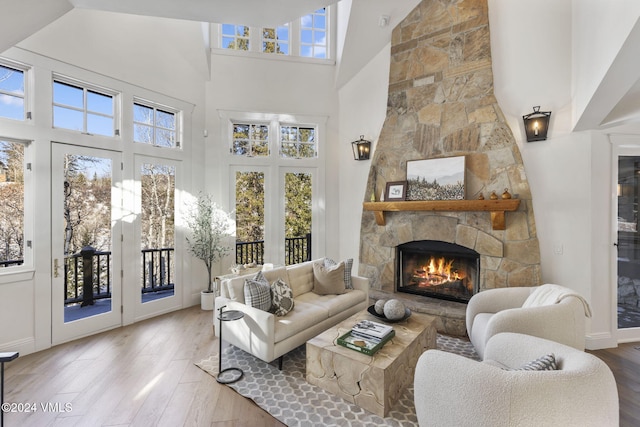 sunroom / solarium featuring a stone fireplace