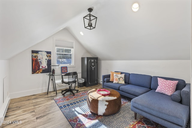 office area featuring hardwood / wood-style floors and vaulted ceiling