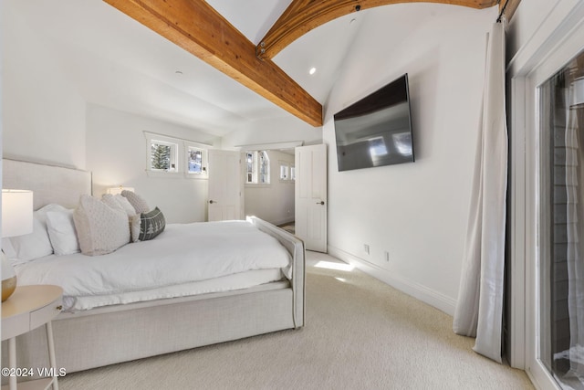 bedroom featuring lofted ceiling with beams and light carpet