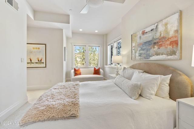 bedroom with light colored carpet and ceiling fan