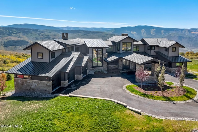 birds eye view of property with a mountain view