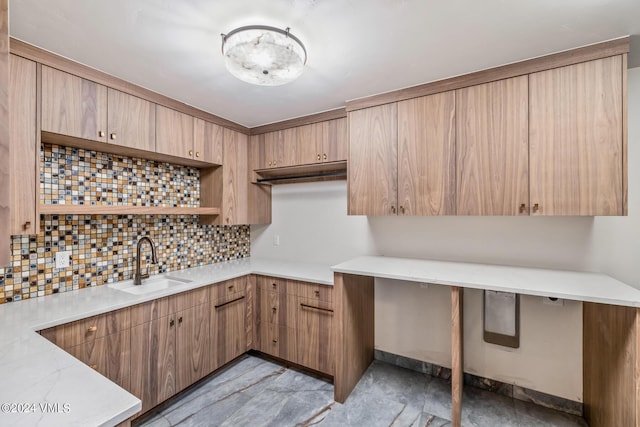 kitchen featuring tasteful backsplash and sink