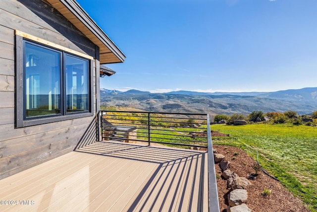 wooden deck featuring a mountain view