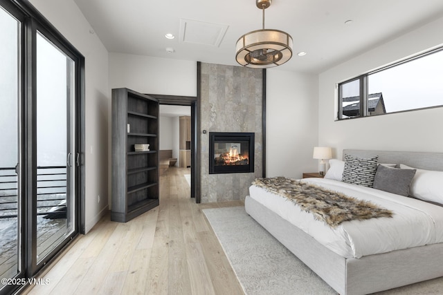 966 Webb Peak, Edwards, CO 81632 - bedroom with light wood-style flooring, a fireplace, and recessed lighting
