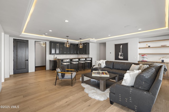 966 Webb Peak, Edwards, CO 81632 - living area with a raised ceiling, wet bar, light wood-type flooring, and recessed lighting