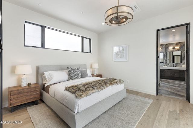 966 Webb Peak, Edwards, CO 81632 - bedroom featuring light wood-style flooring, recessed lighting, baseboards, and ensuite bath