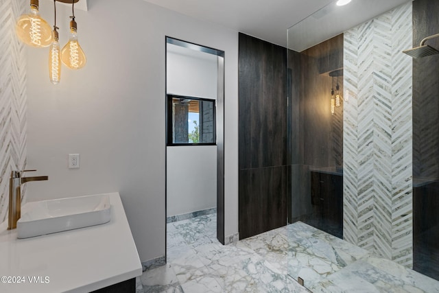 bathroom with vanity and tiled shower