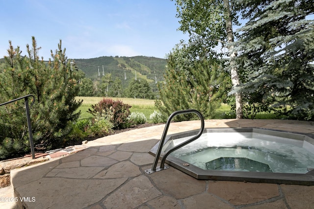 32 Greystone Ct, Beaver Creek, CO 81620 - view of pool with an in-ground hot tub, a mountain view, and a patio