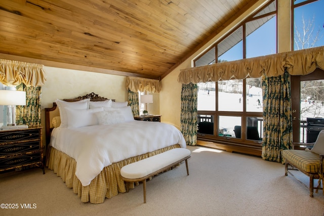 bedroom with wooden ceiling, carpet, and vaulted ceiling