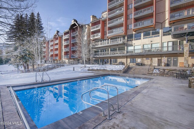 view of snow covered pool