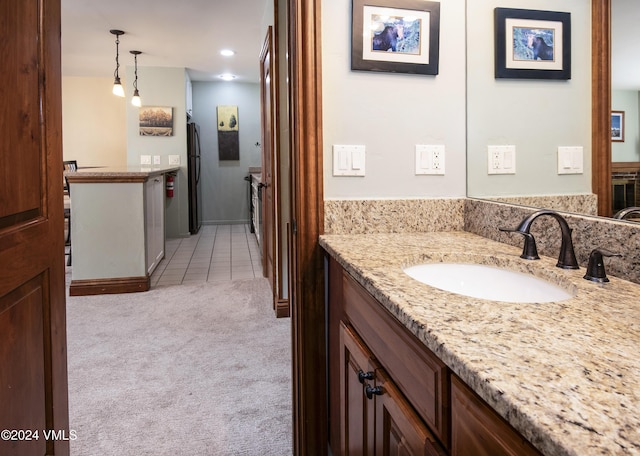 bathroom with vanity and tile patterned flooring